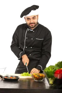 Cheerful chef working in kitchen 스톡 사진