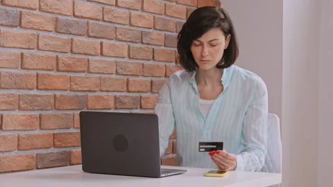 Cheerful client pays online Stock Footage 160635436