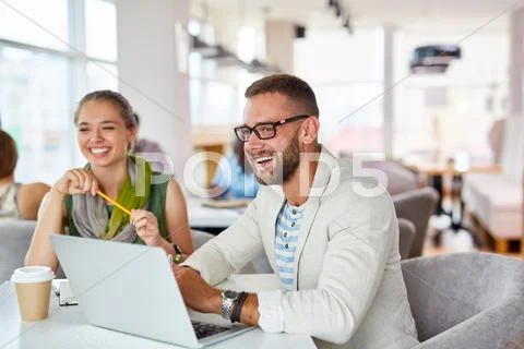 Cheerful colleagues spending break in cafe Stock Photos