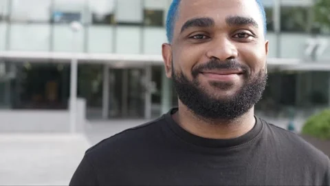 Cheerful confident smiling man walking in modern buildings.MOV 스톡 동영상 285659418