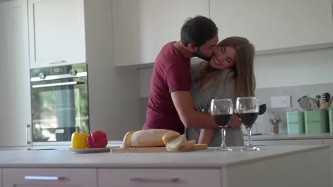 Cheerful couple dancing in kitchen and having fun during breakfast. Carefree hus Stock Footage 219928821