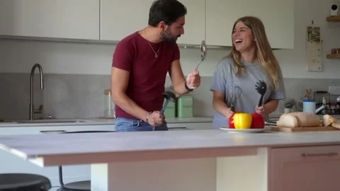 Cheerful couple dancing in kitchen and having fun during breakfast. Carefree hus Stock Footage 219928989