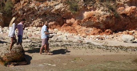 Cheerful Couple Group Going Together Sea Sand Shoreline Show Amazing Waves View Stock Footage 77024934