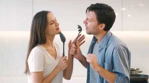 Cheerful couple having fun in the kitchen Stock Footage 149202777