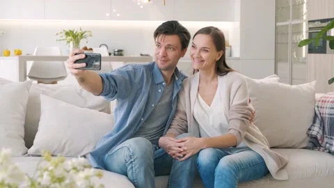 Cheerful couple looking at the smartphone screen Stock Footage 149057719