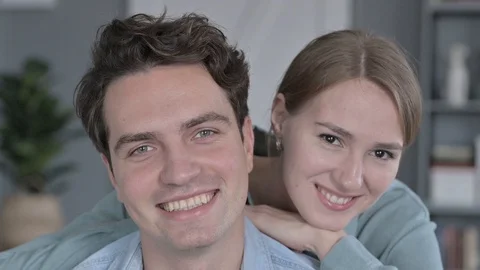 Cheerful Couple Smiling at the Camera while Posing Together Stock Footage 118669118