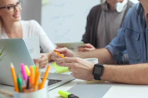 Cheerful creative team is communicating in office Stock Photos