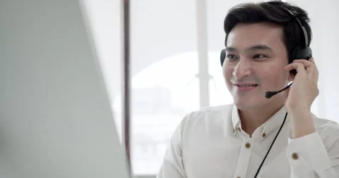 Cheerful Customer Service Representative Assisting via Phone Stock Footage 294478995