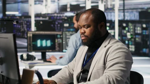Cheerful data center admin pleased after finalizing software upgrade Stock Footage 309365594