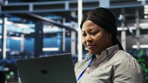 Cheerful data center employee using node tree software to analyze datasets Stock Footage 307019798