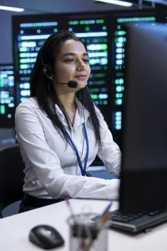 Cheerful data center operator supporting engineering team Stock Photos
