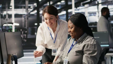 Cheerful data center technicians collaborating on AI automation deployment Stock Footage 309623474