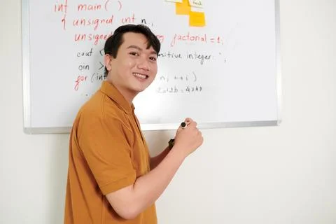 Cheerful Developer Standing at Whiteboard Stock Photos
