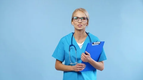 Cheerful doctor talking to the camera   Stock Footage 86051906