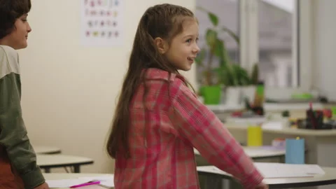 Cheerful elementary school students performing popular dance during break Stock Footage 335684238