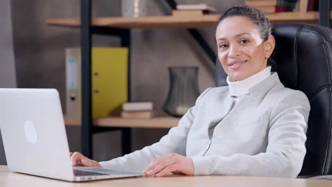 Cheerful employee posing at workspace Stock Footage 154542260