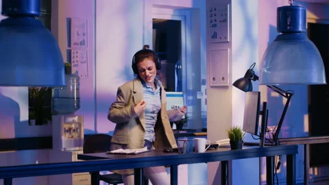 Cheerful employee working on research with headset Stock Footage 238410879