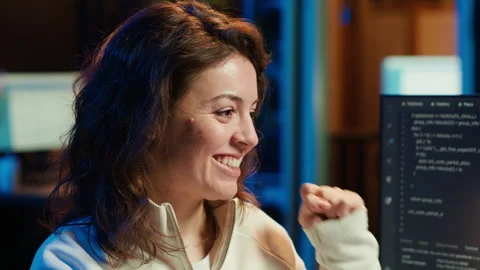 Cheerful engineer excited after finding no errors in code Stock Footage 283691985