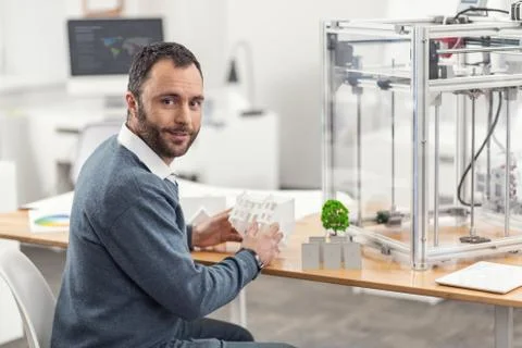 Cheerful engineer posing while working on eco-city project Stock Photos