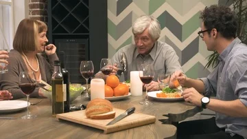 Cheerful family communicates at dinner table Stock Footage 85950486