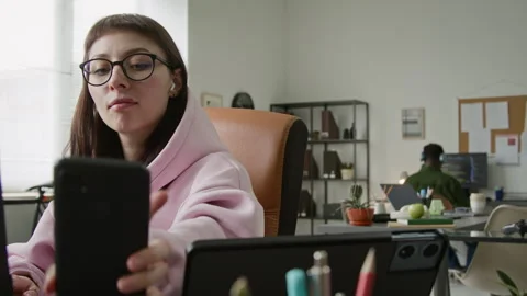 Cheerful Female Developer Turning on Music while Working on Code in Office Video stock 335938564