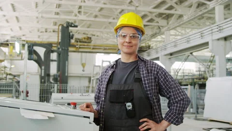 Cheerful Female Engineer Posing on Camera at Industrial Plant Stock Footage 248419443