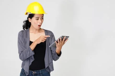 Cheerful female engineer using tablet in studio Stock Photos