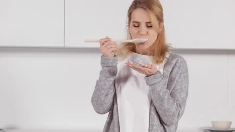 Cheerful female in the kitchen Stock Footage 150202449