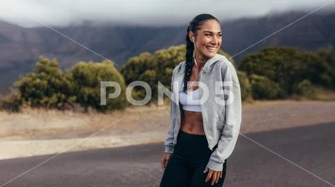 Cheerful fitness woman on morning workout Stock Photos