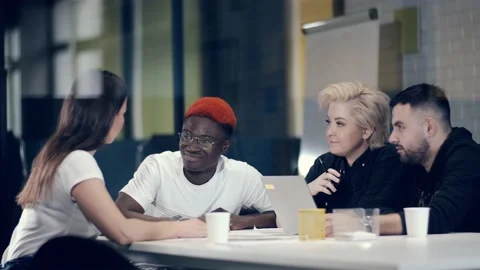 Cheerful friendly communication of young creative people. Video stock 141436565