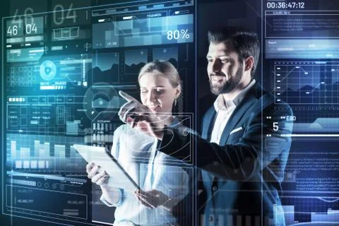 Cheerful friendly programmers smiling while working together Foto stock