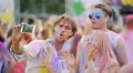 Cheerful friends dancing and singing at concert, filming video on mobile gadget 4k or 4k+ Resolution