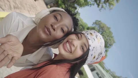 Cheerful friends posing for selfie video together Stock Footage 345683591