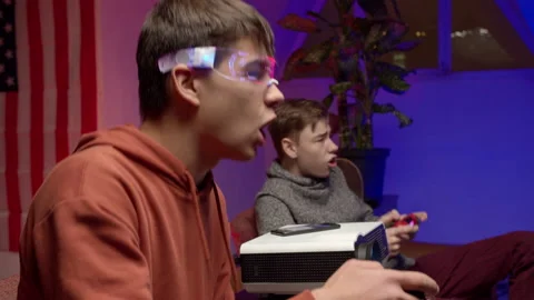 Cheerful friends singing and playing videogame together Stock Footage 147398231