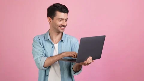 Cheerful funny programmer remote worker typing netbook code Stock Footage 162038237