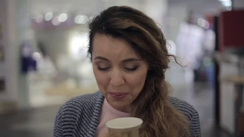 Cheerful girl having fun drinking coffe in cafe Stock Footage 78403741