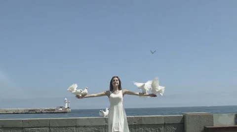 Cheerful Girl Releasing A White Doves Stock Footage