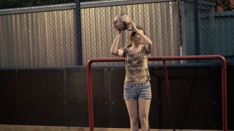 Cheerful girl throwing a soccer ball. Woman football team Stock Footage
