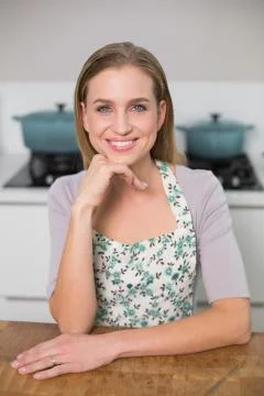 Cheerful gorgeous model sitting at table Foto stock