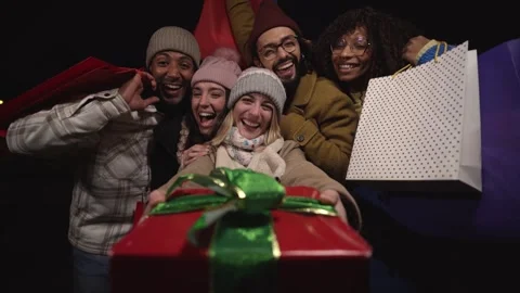 Cheerful group of multiracial friends looking to camera happy and giving a big Stock Footage 252189118