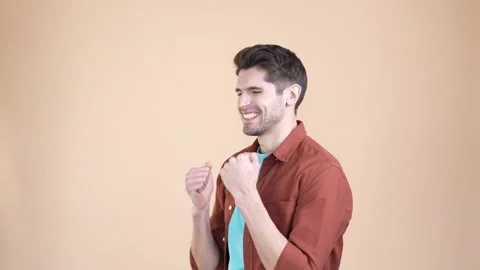Cheerful guy clench fist up win lucky jackpot isolated pastel color background Stock Footage 169937056