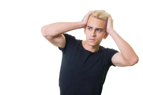 Cheerful guy in glasses posing in studio isolated on white background. holdin Stock Photos