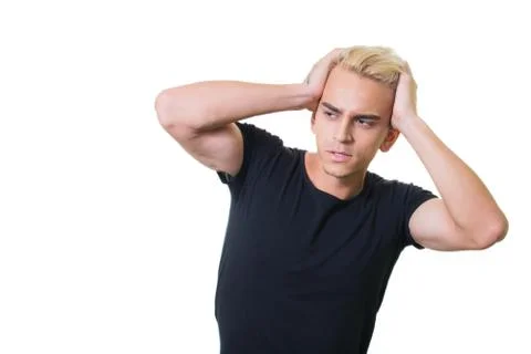 Cheerful guy in glasses posing in studio isolated on white background. holdin Stock Photos