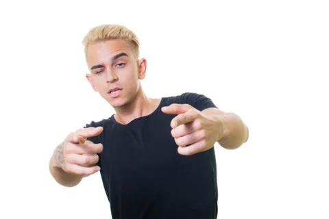Cheerful guy in glasses posing in studio isolated on white background. flirts Stock Photos