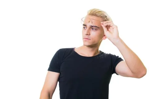 Cheerful guy in glasses posing in studio isolated on white background. Stock Photos