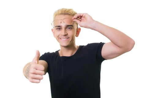 Cheerful guy in glasses posing in studio isolated on white background. thumb  Stock Photos