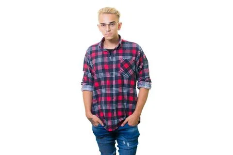 Cheerful guy in glasses posing in studio isolated on white background. 写真素材