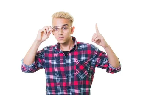 Cheerful guy in glasses posing in studio isolated on white background. points Stock Photos