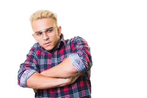 Cheerful guy in glasses posing in studio isolated on white background. Stock Photos