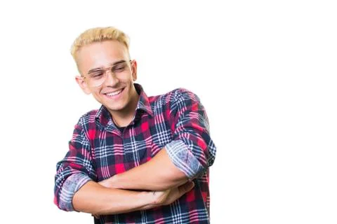 Cheerful guy in glasses posing in studio isolated on white background. Stock Photos